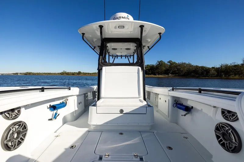Slide: The Image of 2023 Yellowfin 32 Offshore boat interior with Garmin equipment, on calm water. - 46