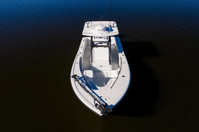 Slide: The Image of 2023 Yellowfin 32 Offshore boat on calm water, aerial view. - 5