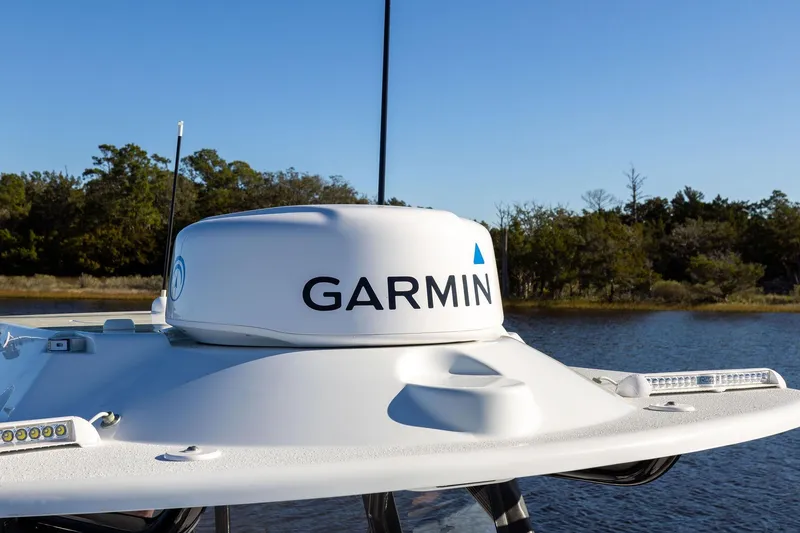 Slide: The Image of 2023 Yellowfin 32 Offshore boat with Garmin radar on calm water. - 50