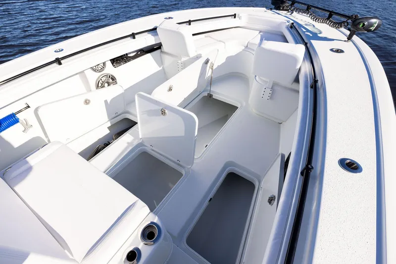 Slide: The Image of 2023 Yellowfin 32 Offshore boat interior with open storage compartments and seating. - 53