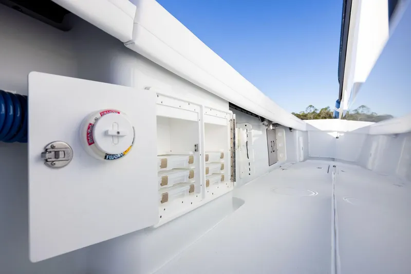 Slide: The Image of 2023 Yellowfin 32 Offshore boat interior with storage compartments and clean design. - 62