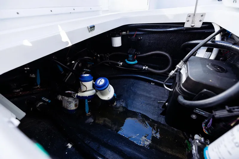 Slide: The Image of Engine compartment of 2023 Yellowfin 32 Offshore boat, showcasing mechanical components and wiring. - 66