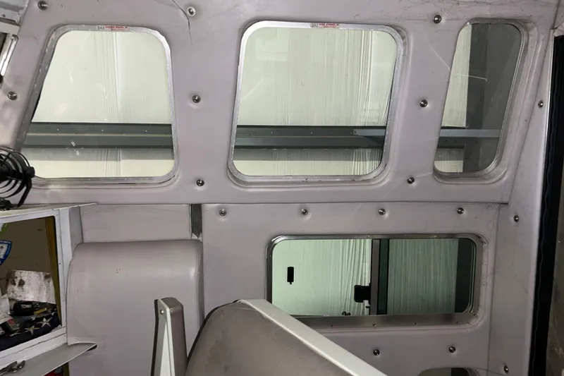 Slide: The Image of Interior view of a 1963 Motor Life Boat 44, showcasing windows and control area. - 12