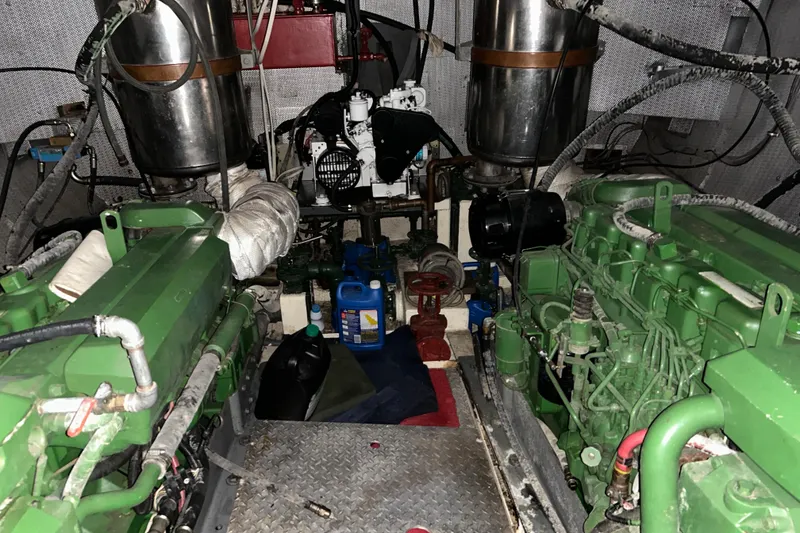 Slide: The Image of Engine room of a 1963 Motor Life Boat 44, featuring green machinery and equipment. - 20