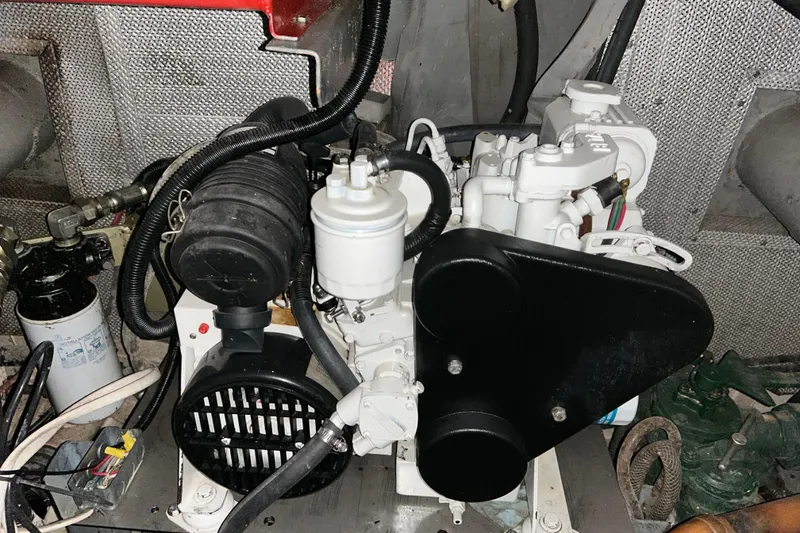 Slide: The Image of Engine compartment of a 1963 Motor Life Boat model 44, showcasing mechanical components. - 21