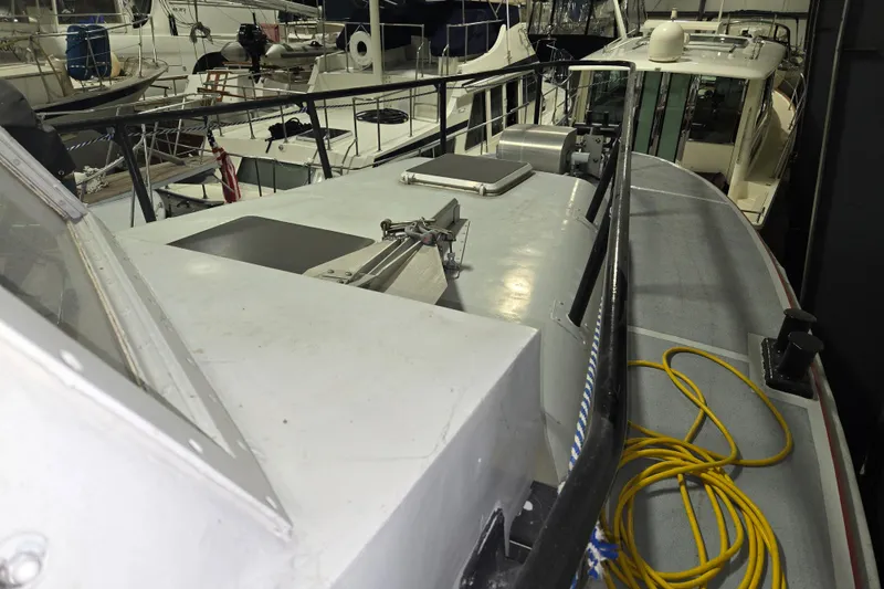 Slide: The Image of 1963 Motor Life Boat 44 model docked among other boats in a marina. - 5