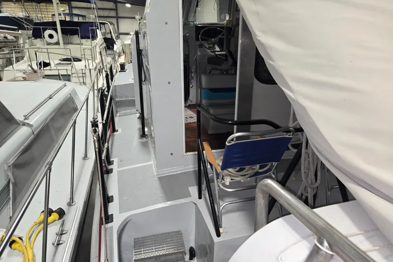 Slide: The Image of 1963 Motor Life Boat 44 model in a marina, showcasing deck and interior details. - 6