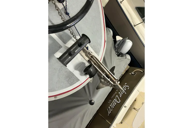 Slide: The Image of 1963 Motor Life Boat 44 with anchor and chain detail, docked near other boats. - 8