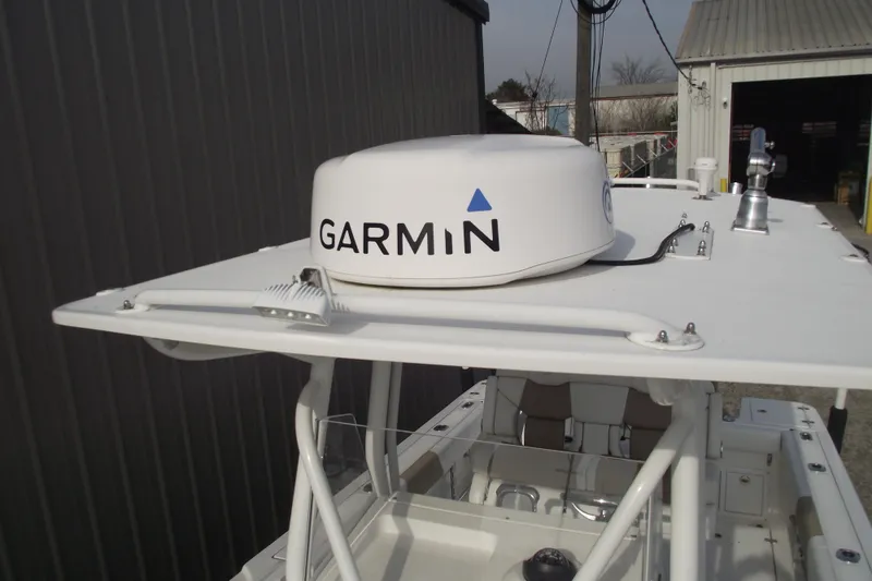 Slide: The Image of Open storage compartment on a 2019 Edgewater 245CC boat. - 14