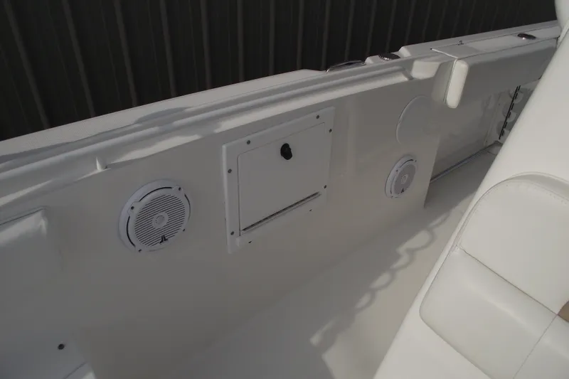 Slide: The Image of 2019 Edgewater 245CC boat interior with seating and storage compartments. - 18