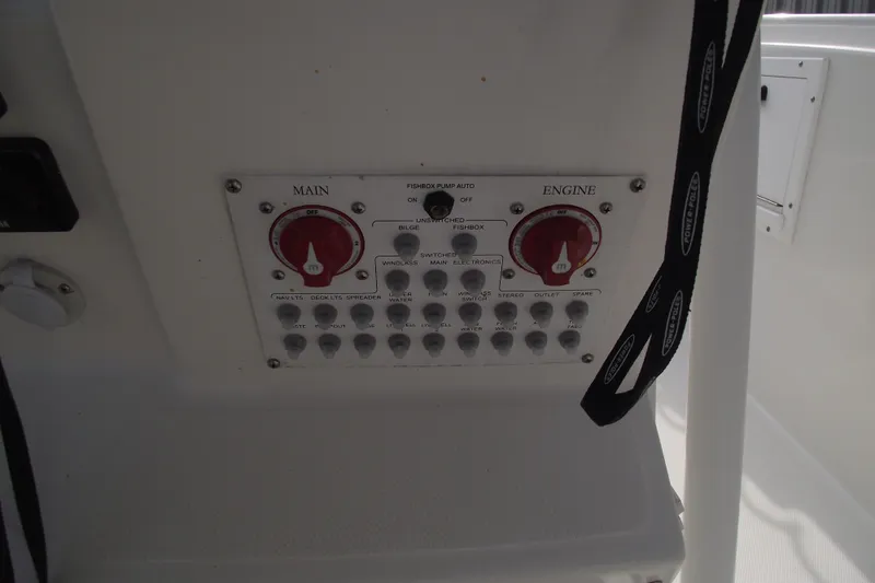 Slide: The Image of 2019 Edgewater 245CC boat dashboard with navigation screens and controls. - 25