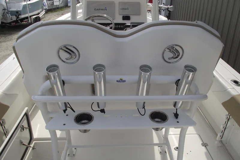 Slide: The Image of 2019 Edgewater 245CC boat console with steering wheel and controls. - 26