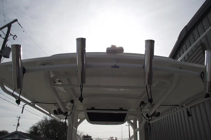 Slide: The Image of Control panel of a 2019 Edgewater 245CC boat with switches and dials. - 27