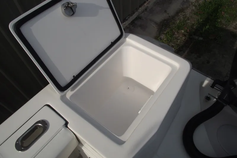 Slide: The Image of Open storage compartment on a 2019 Edgewater 245CC boat. - 31