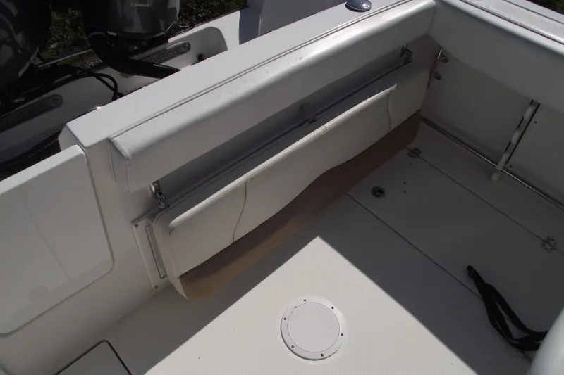 Slide: The Image of 2019 Edgewater 245CC boat interior with foldable seat and Yamaha engines. - 36