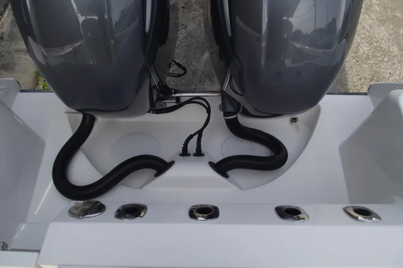 Slide: The Image of 2019 Edgewater 245CC boat with dual outboard motors and sleek design. - 37