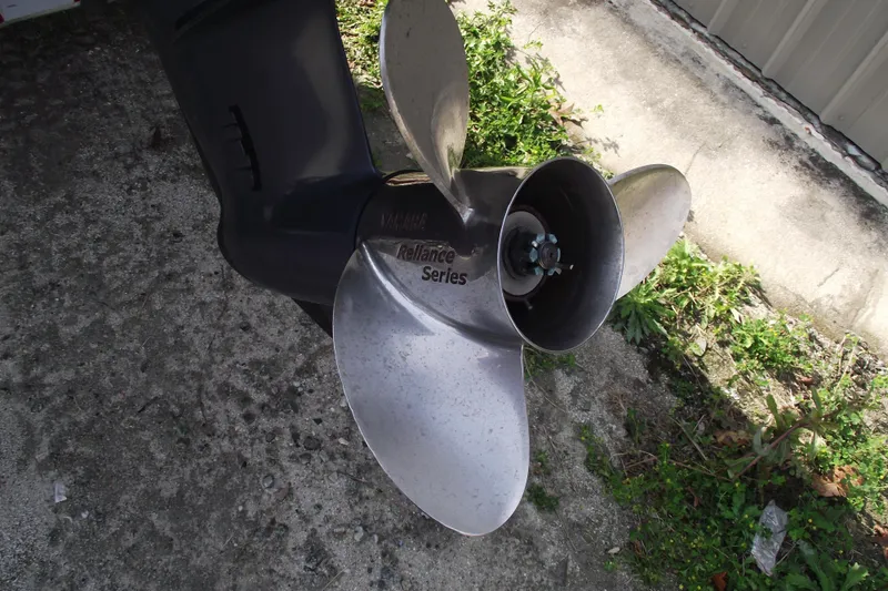 Slide: The Image of Propeller of 2019 Edgewater 245CC boat, Yamaha Reliance Series, on concrete surface. - 5
