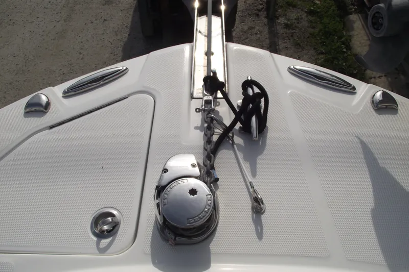 Slide: The Image of Bow of 2019 Edgewater 245CC boat with anchor chain and cleats. - 6