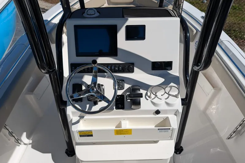 Slide: The Image of 2026 Key West 239 FS boat console with steering wheel and controls. - 17
