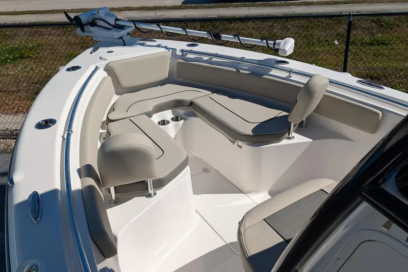 Slide: The Image of 2026 Key West 239 FS boat interior with cushioned seating and fishing rod holder. - 19