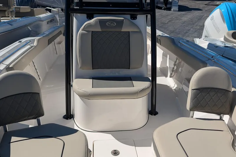 Slide: The Image of 2026 Key West 239 FS boat interior with cushioned seating and sleek design. - 20