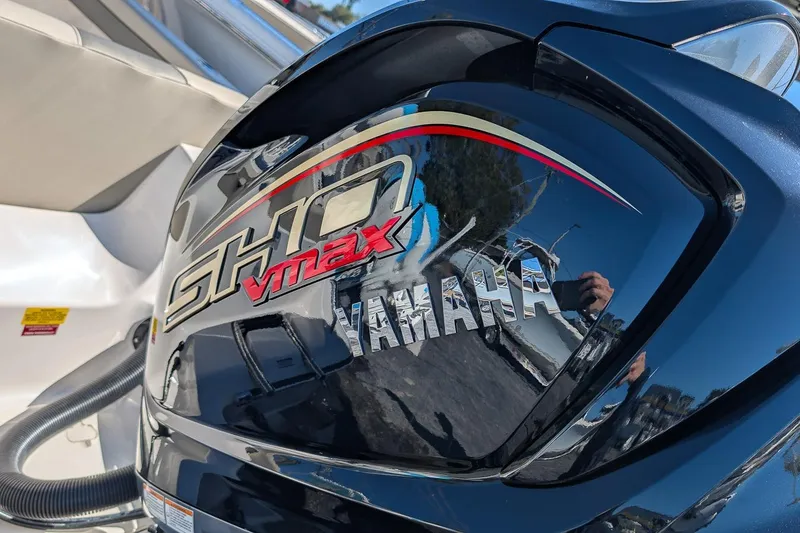 Slide: The Image of Yamaha SHO VMAX engine on 2026 Key West 239 FS boat, reflecting surroundings. - 8