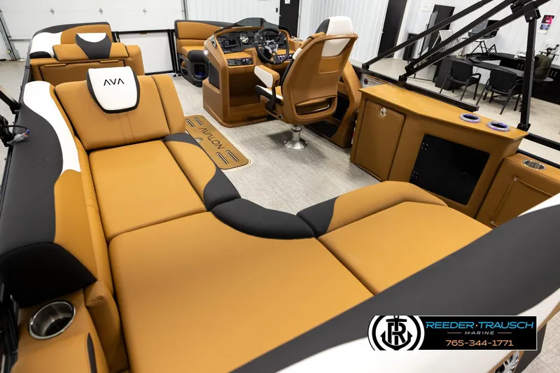 Slide: The Image of Luxurious interior of 2026 Avalon LSZ CRB boat with tan and black seating. - 11