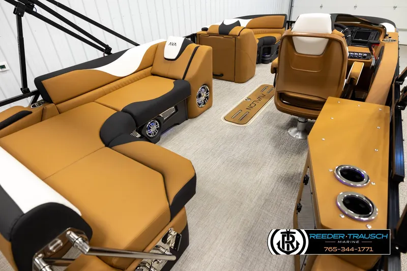 Slide: The Image of Luxurious interior of 2026 Avalon LSZ CRB pontoon boat with tan and black seating. - 12