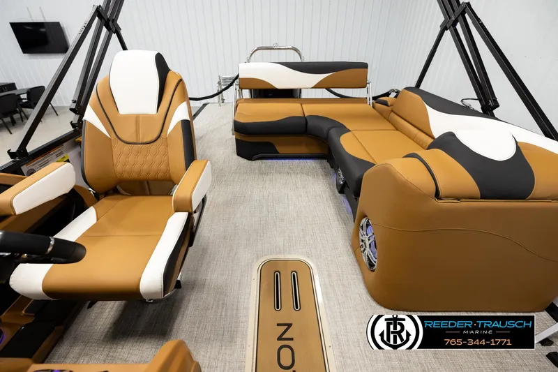 Slide: The Image of Luxurious interior of 2026 Avalon LSZ CRB boat with tan and white seating. - 14