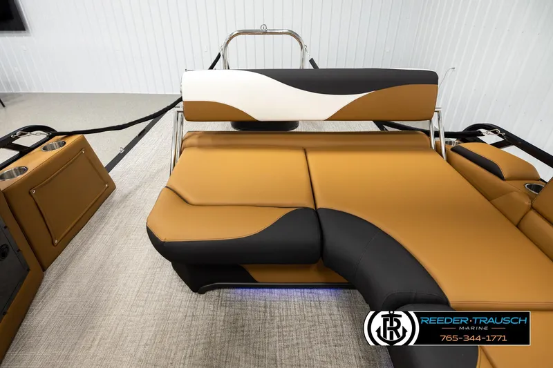 Slide: The Image of 2026 Avalon LSZ CRB boat interior with tan and black seating, cup holders, and modern design. - 15