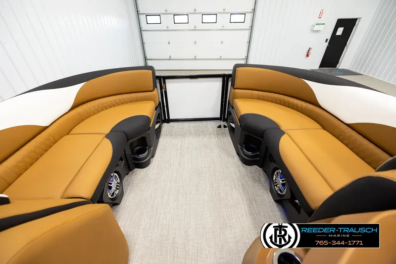 Slide: The Image of Luxurious interior of 2026 Avalon LSZ CRB pontoon boat with tan seating and cup holders. - 18