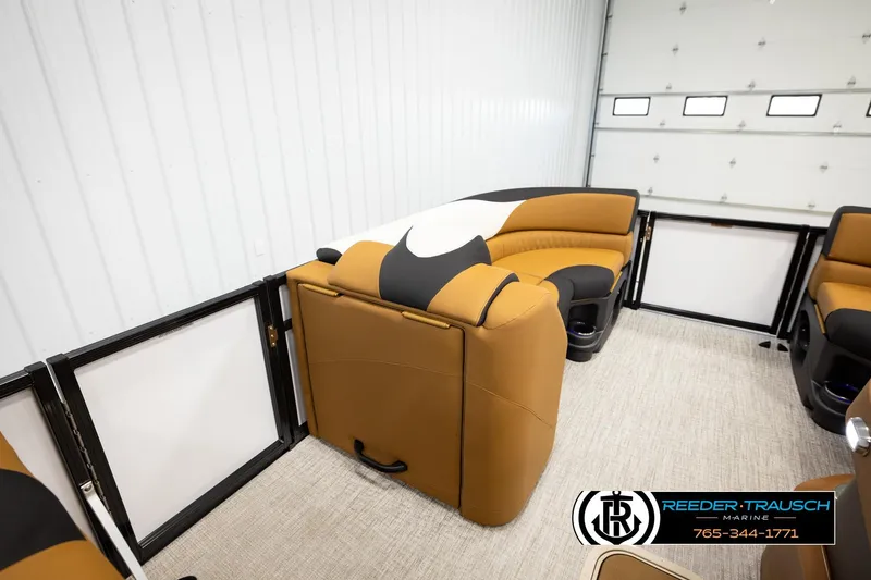 Slide: The Image of 2026 Avalon LSZ CRB pontoon boat interior with tan and black seating. - 20