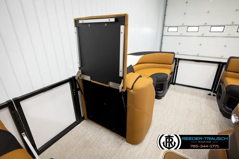 Slide: The Image of 2026 Avalon LSZ CRB boat interior with tan and black seating, showcasing modern design. - 21