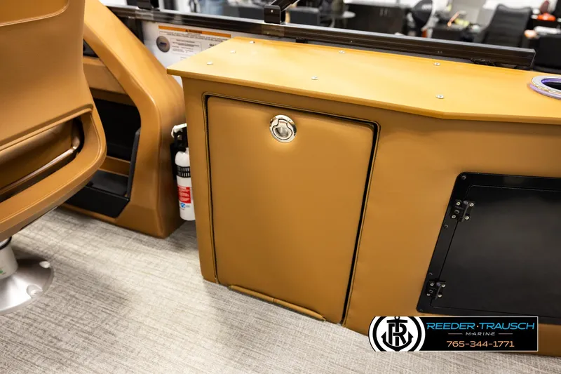 Slide: The Image of 2026 Avalon LSZ CRB boat interior with tan cabinetry and safety equipment. - 27