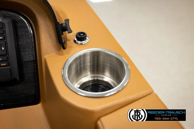 Slide: The Image of 2026 Avalon LSZ CRB boat console with cup holder and control panel. - 36