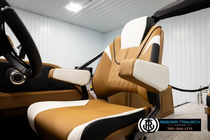 Slide: The Image of 2026 Avalon LSZ CRB boat seat in a showroom, featuring tan and white upholstery. - 39