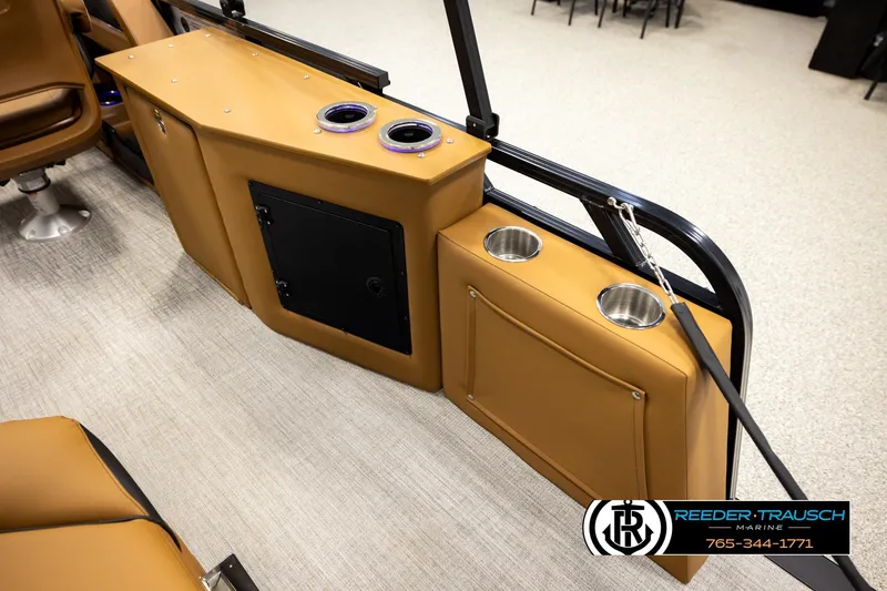 Slide: The Image of 2026 Avalon LSZ CRB boat interior with tan seating and cup holders. - 42