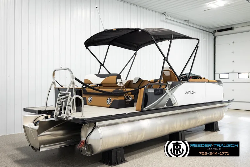 Slide: The Image of 2026 Avalon LSZ CRB pontoon boat in showroom, featuring sleek design and modern amenities. - 6