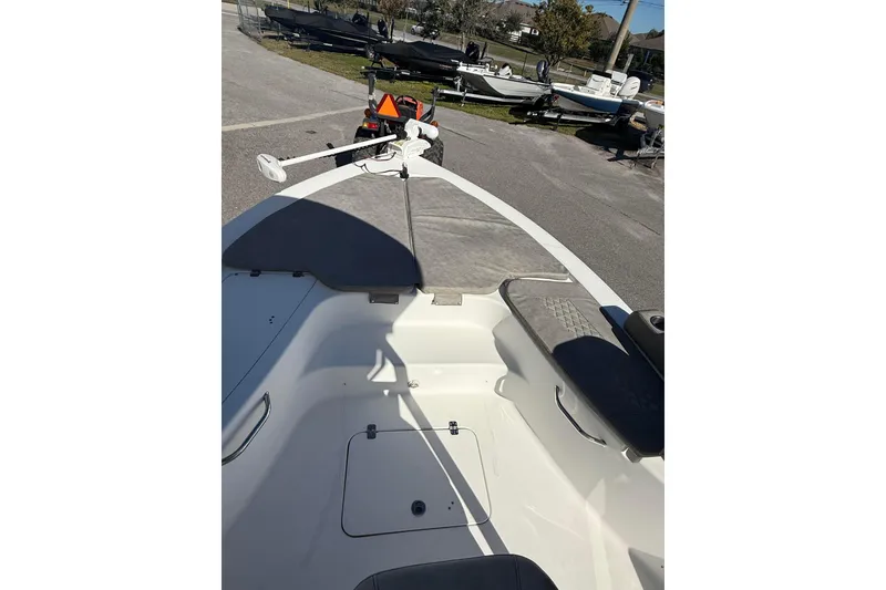 Slide: The Image of 2022 Sea Pro 248 Bay boat deck with seating and storage compartments. - 10