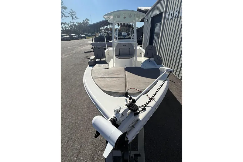 Slide: The Image of 2022 Sea Pro 248 Bay boat with modern design, parked outdoors. - 5