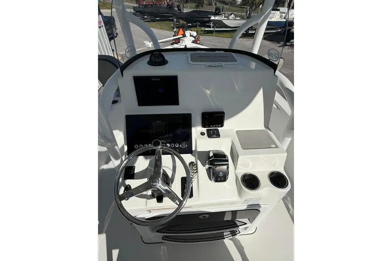 Slide: The Image of 2022 Sea Pro 248 Bay boat console with steering wheel and controls. - 6