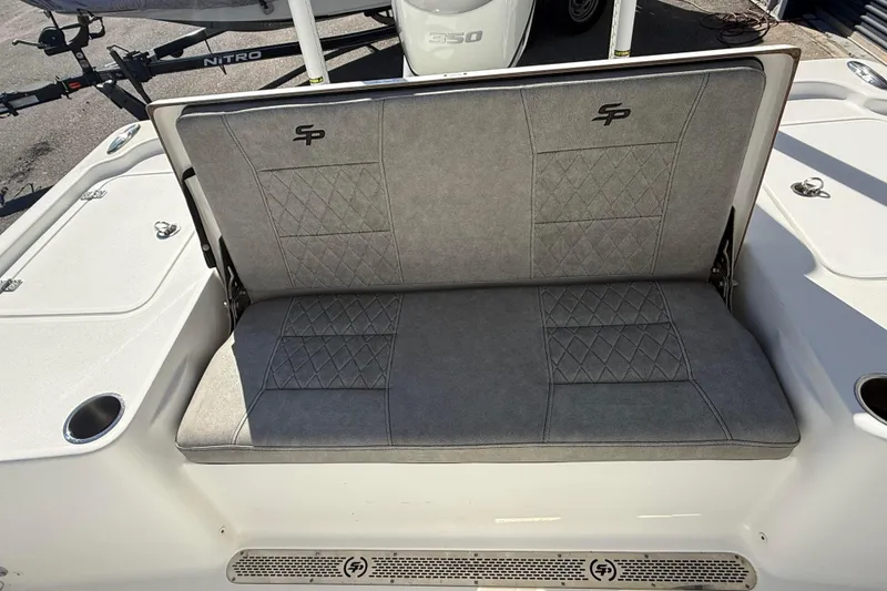 Slide: The Image of 2022 Sea Pro 248 Bay boat with gray cushioned seating and diamond stitching. - 8