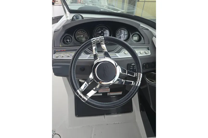 Slide: The Image of Steering wheel and dashboard of 2021 Monterey 255SS Super Sport boat. - 12