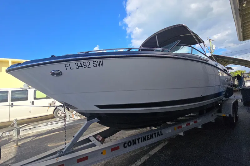 Slide: The Image of 2021 Monterey 255SS Super Sport boat on trailer under blue sky. - 3