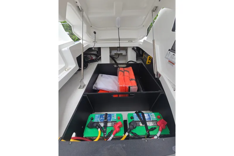 Slide: The Image of 2021 Monterey 255SS Super Sport boat storage with batteries and life jackets. - 5