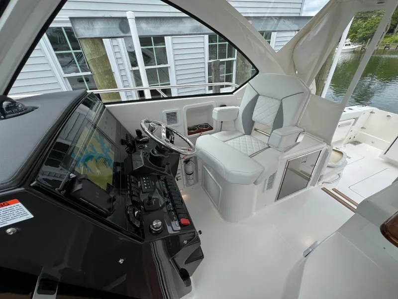 Slide: The Image of 2025 Pursuit OS 325 Offshore boat cockpit with modern controls and comfortable seating. - 17