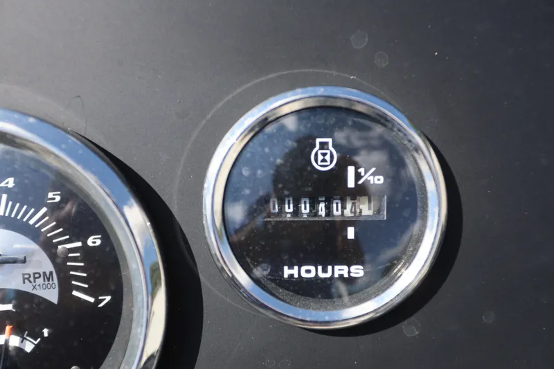 Slide: The Image of Dashboard of 2023 Crest Classic LX 220 SLC showing RPM and hour meter. - 14