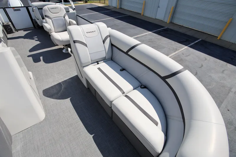Slide: The Image of 2023 Crest Classic LX 220 SLC boat interior with plush seating and modern design. - 17