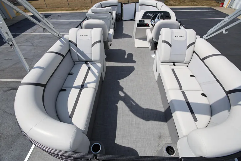 Slide: The Image of 2023 Crest Classic LX 220 SLC pontoon boat with spacious seating and modern design. - 7