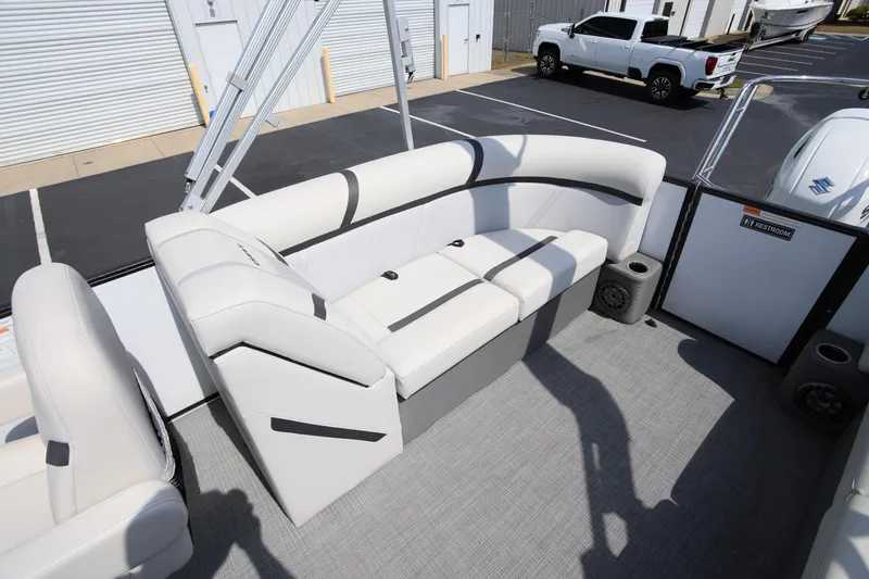 Slide: The Image of 2023 Crest Classic LX 220 SLC boat interior with white seating and modern design. - 8
